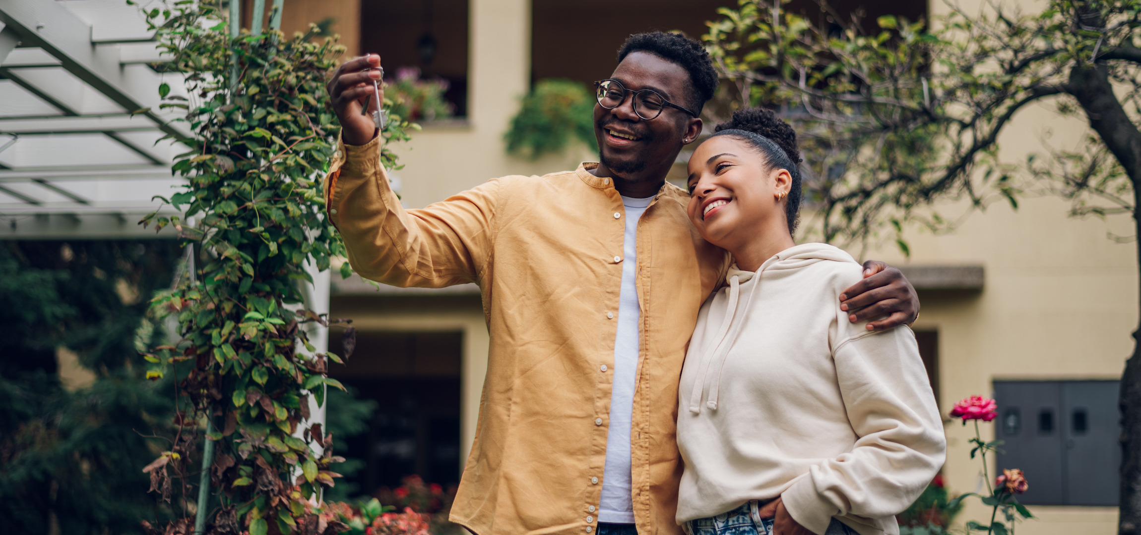 A couple standing in a garden