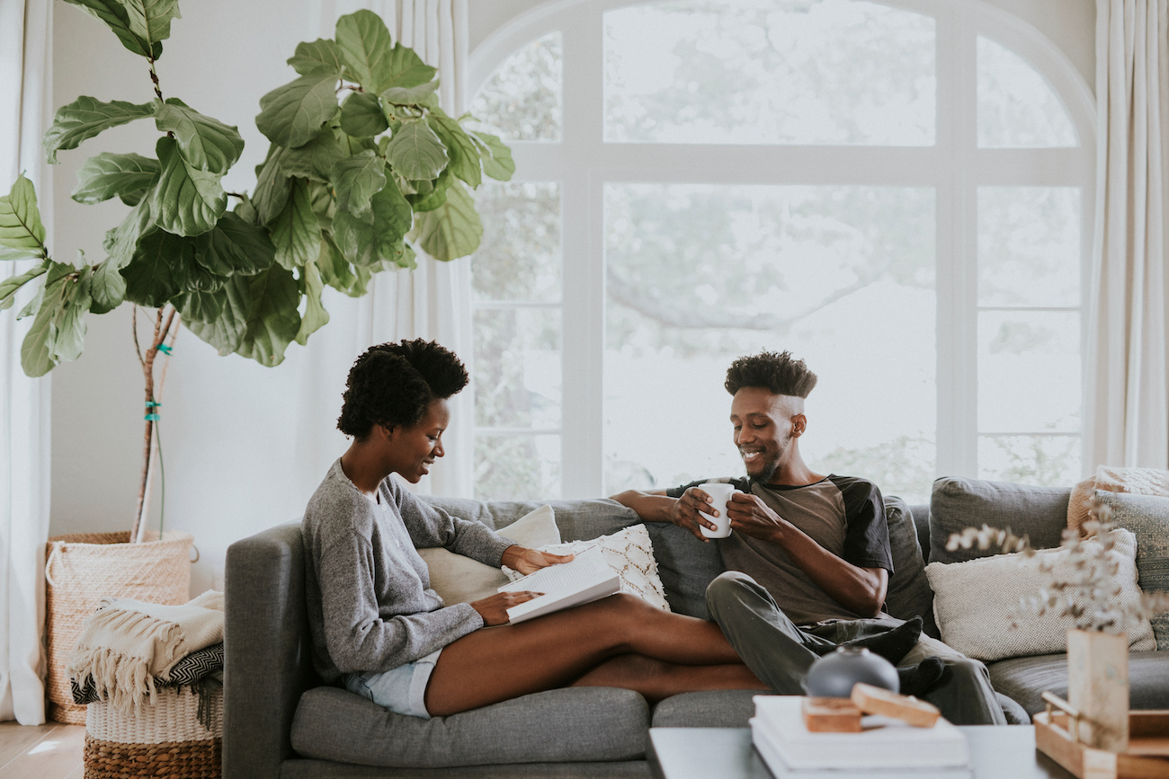 Couple sitting on a sofa at home